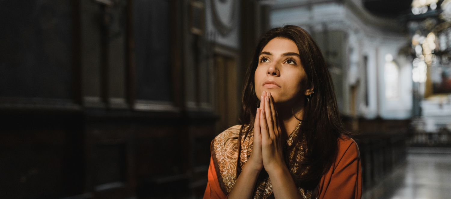 a woman deeply engaged in prayer